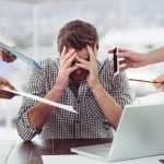 Stressed property manager frustrated with electronic devices